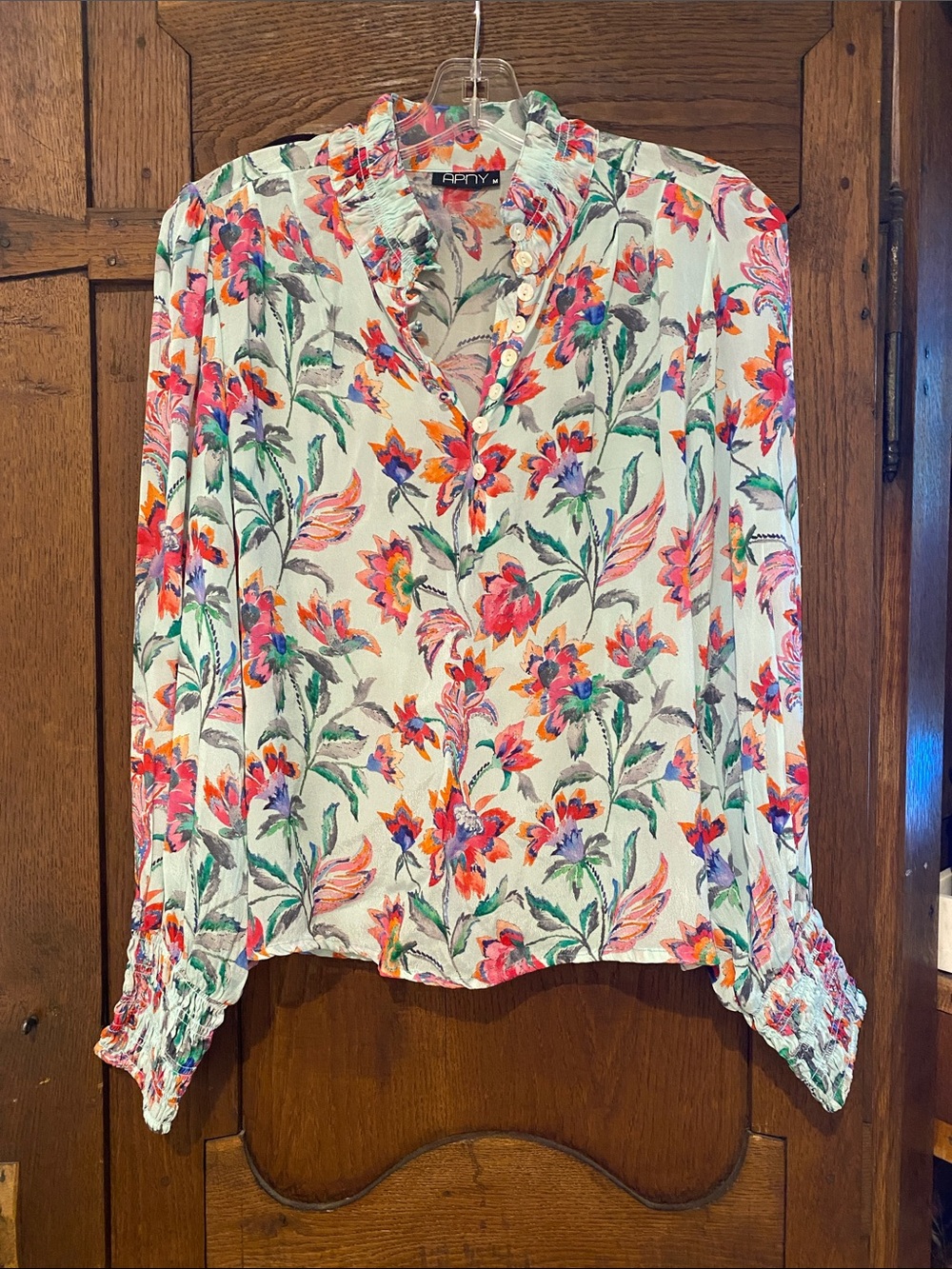 APNY floral blouse.  Long sleeve ruffle neck and cuff.